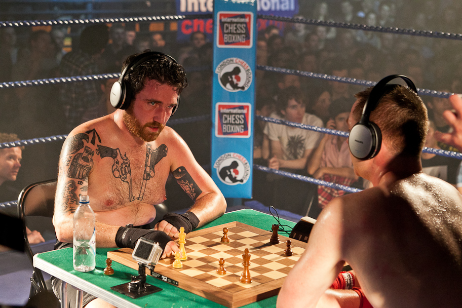 Chessboxing, boxing and chess board game being played alternately as part  of a new surreal sport, Islington, London, UK Stock Photo - Alamy